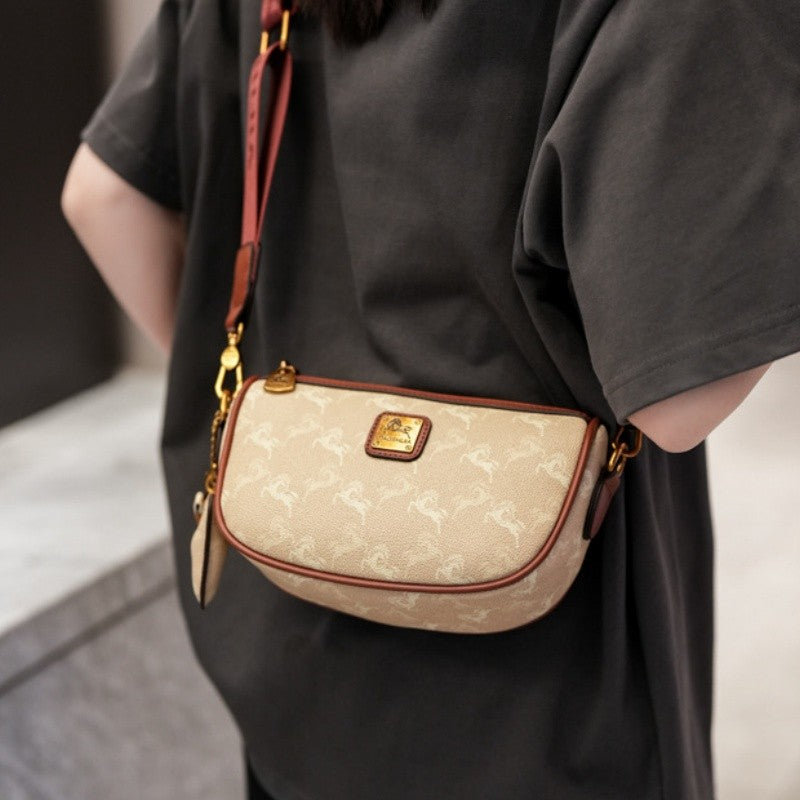 Classic style handbag with strap, featuring a shoulder-sling design, suitable for women, with a bag shape resembling