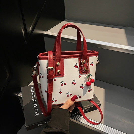 Women PU Cherry Shoulder Bag Large Capacity Trendy Commuting Bag with Cherry Pendant Stylish Crossbody Bag Aesthetic Handbag