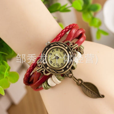 Foreign trade hot selling retro cowhide wrapped bracelet watch, ladies' delicate watch, leaf and leaf pendant decoration, studen