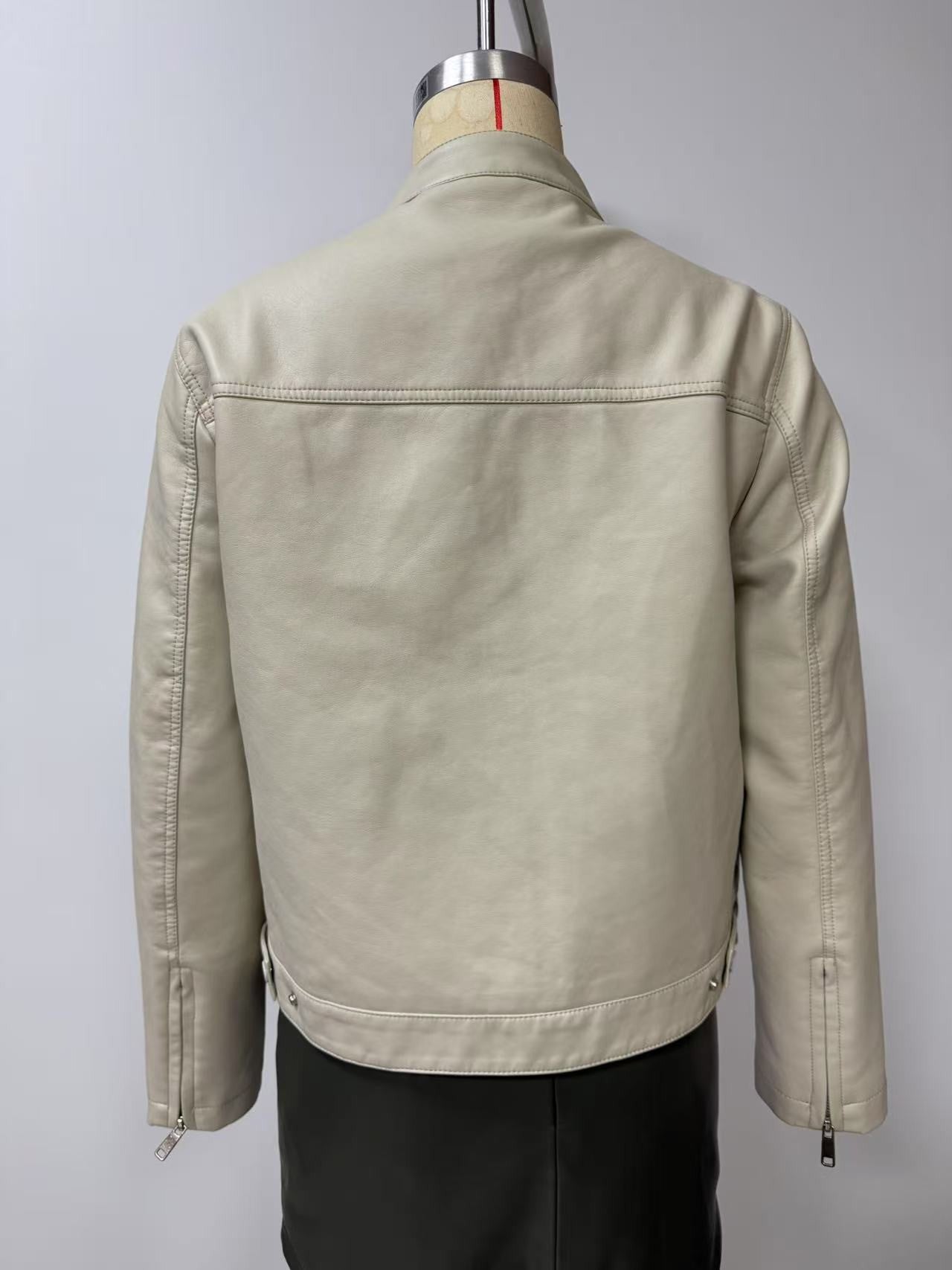 Black Women's Fitted Leather Jacket with Front Zipper & Side Pockets?, Available in Brown, Navy Blue, and Beige.