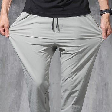 2025 New Korean Ice Silk Elastic Trousers Four Seasons Thin Casual Men'S Loose 9-Point Large Size Small Foot Sports Pants Spring