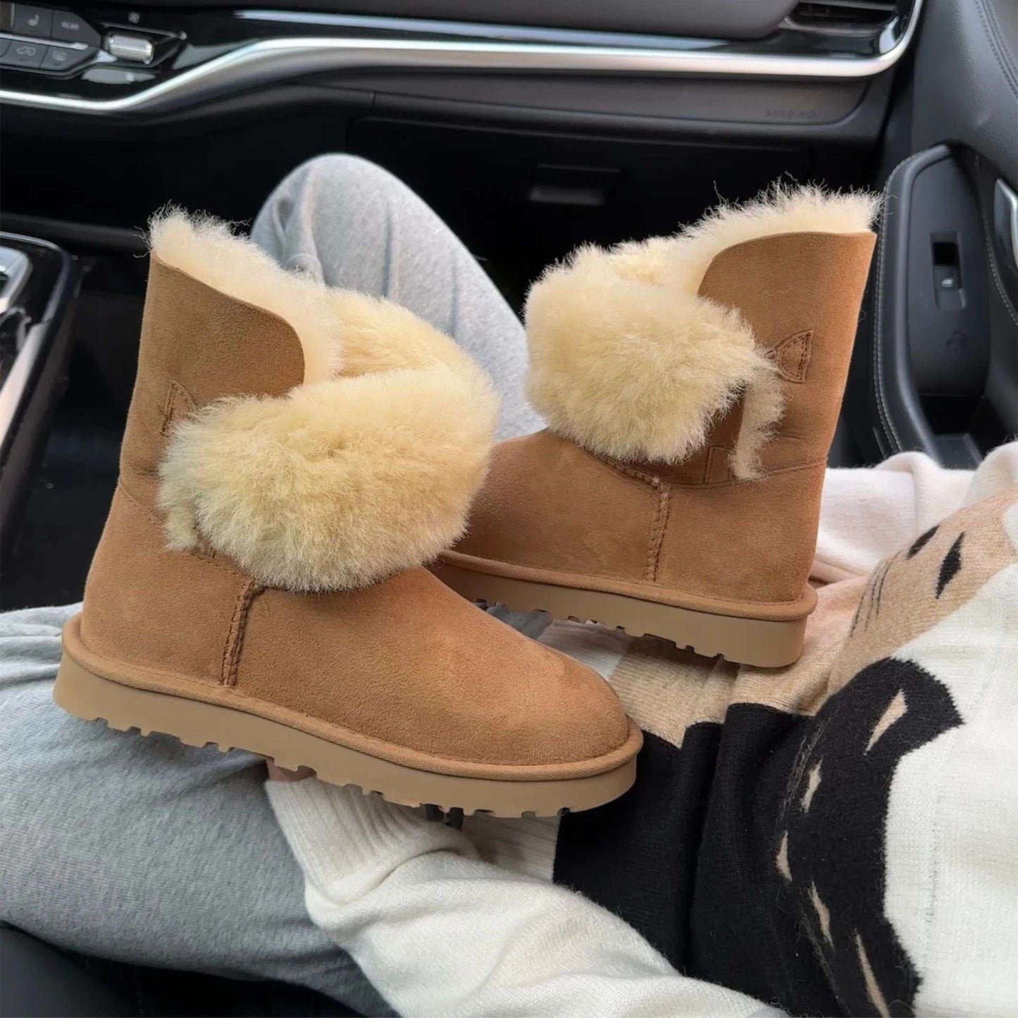 A pair of pure sheepskin and wool winter snow boots for women, warm and comfortable. Simple and fashionable women's shoes