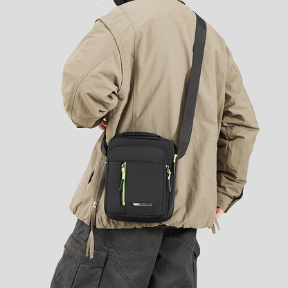 1 men's crossbody bag with zip closure, adjustable shoulder strap, and multiple storage compartments, suitable for daily commuti