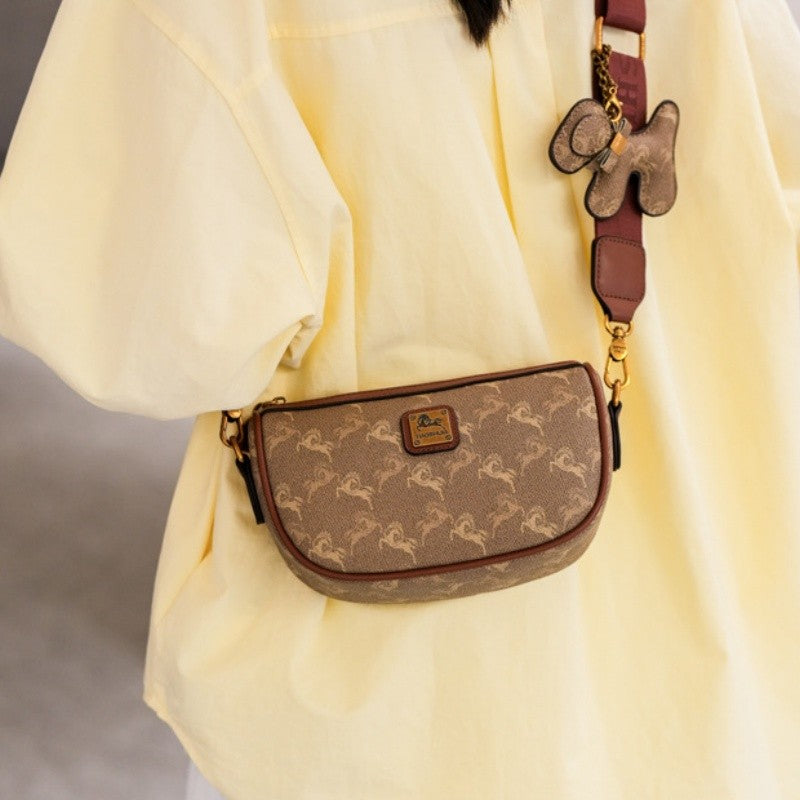 Classic style handbag with strap, featuring a shoulder-sling design, suitable for women, with a bag shape resembling