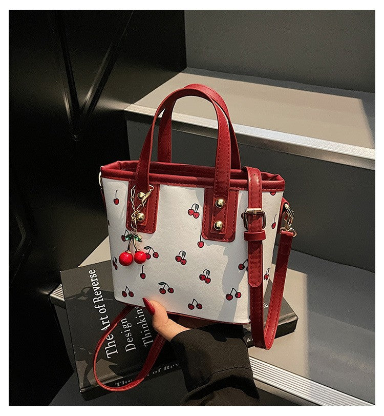 Women PU Cherry Shoulder Bag Large Capacity Trendy Commuting Bag with Cherry Pendant Stylish Crossbody Bag Aesthetic Handbag