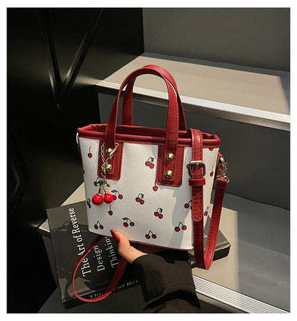 Women PU Cherry Shoulder Bag Large Capacity Trendy Commuting Bag with Cherry Pendant Stylish Crossbody Bag Aesthetic Handbag
