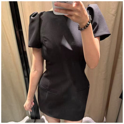 Women's black short puff sleeve mini dress with a stylish boat neckline design and pocket details, suitable for elegant occasion