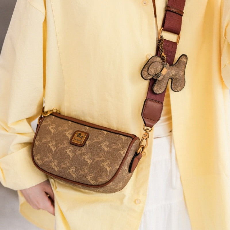 Classic style handbag with strap, featuring a shoulder-sling design, suitable for women, with a bag shape resembling