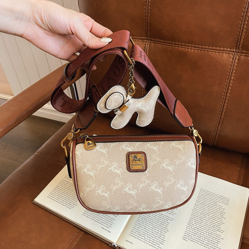 Classic style handbag with strap, featuring a shoulder-sling design, suitable for women, with a bag shape resembling