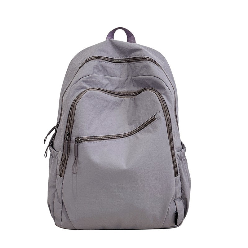 Backpack, large capacity, adjustable shoulder straps, suitable for school, campus travel, and work, with a secure zipper closure