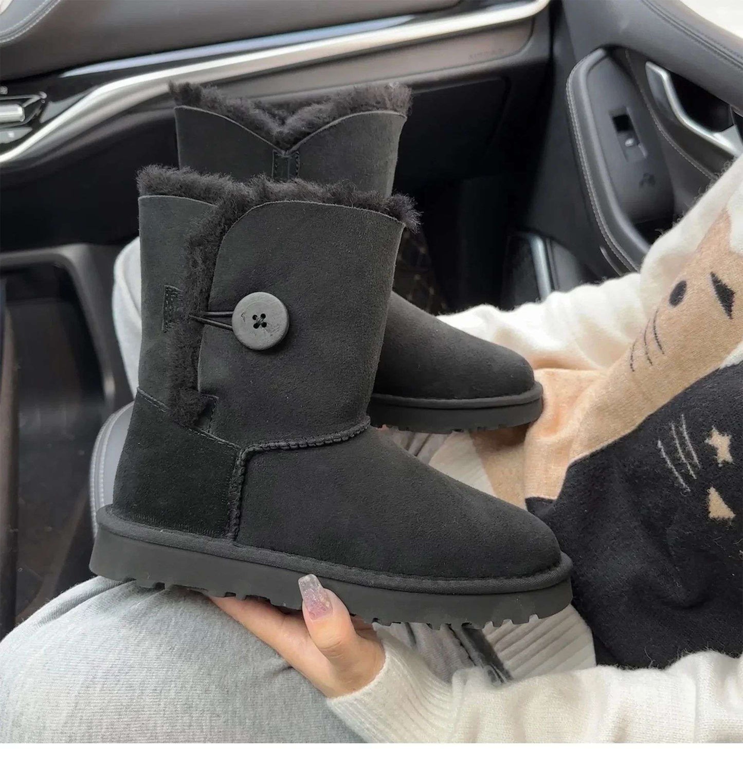 A pair of pure sheepskin and wool winter snow boots for women, warm and comfortable. Simple and fashionable women's shoes
