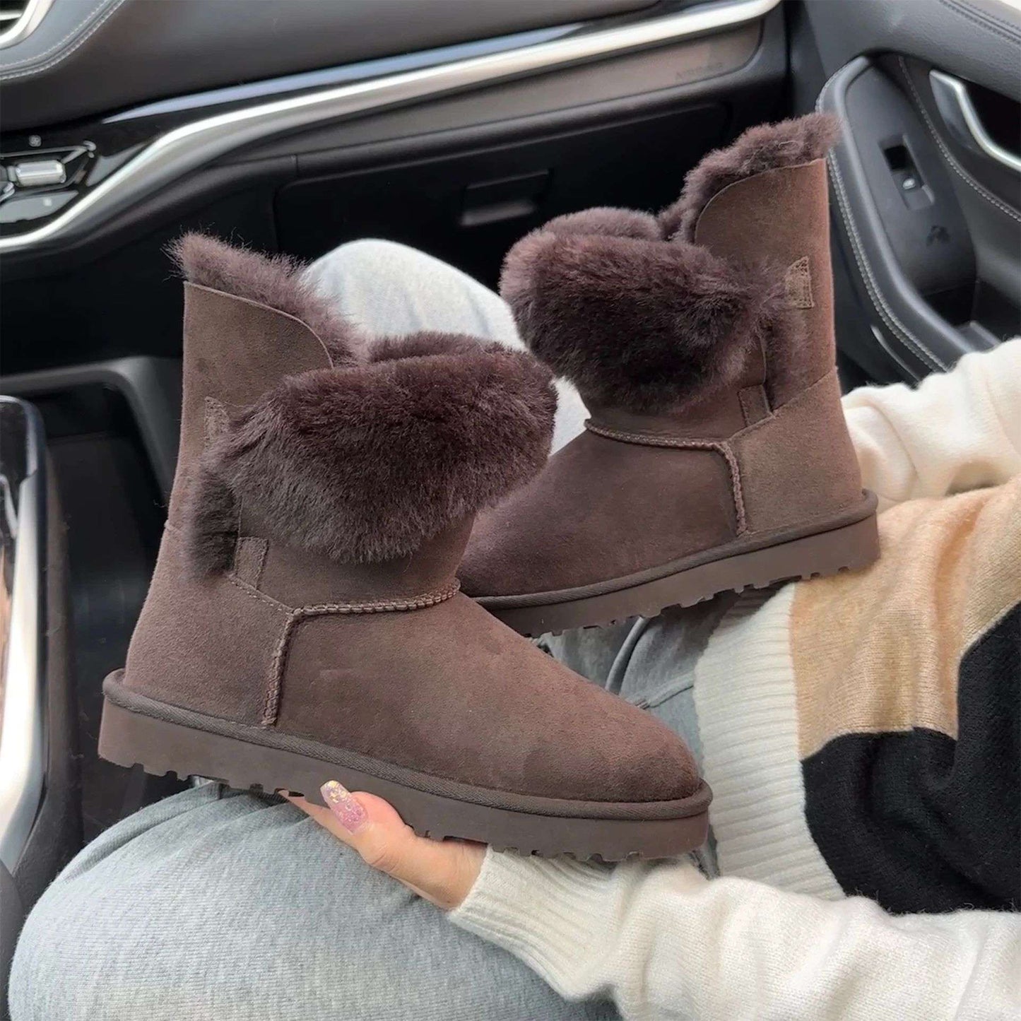 A pair of pure sheepskin and wool winter snow boots for women, warm and comfortable. Simple and fashionable women's shoes