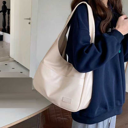 Large capacity tote bag, new black leather simple casual commuting women's bag, fashionable and versatile single shoulder bag