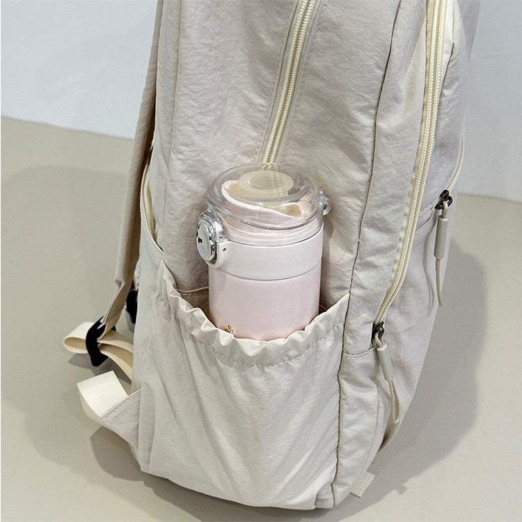 Backpack, large capacity, adjustable shoulder straps, suitable for school, campus travel, and work, with a secure zipper closure