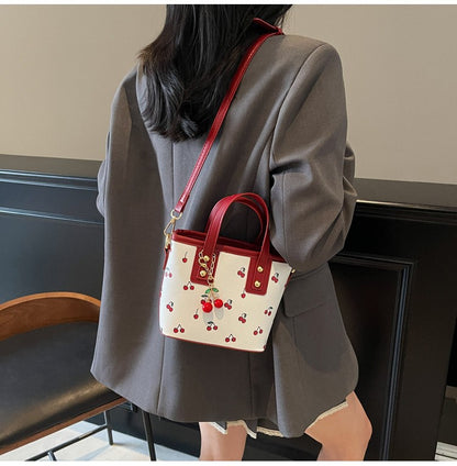 Women PU Cherry Shoulder Bag Large Capacity Trendy Commuting Bag with Cherry Pendant Stylish Crossbody Bag Aesthetic Handbag