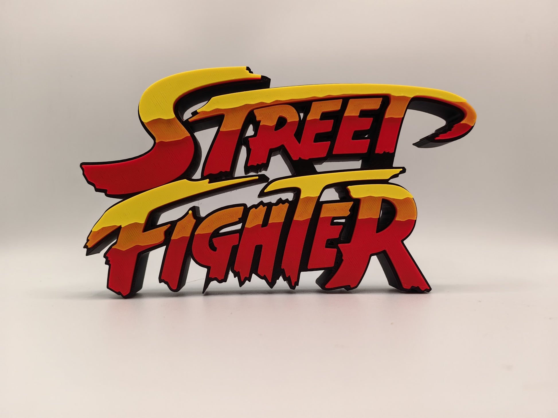 Street Fighter, Street Fighter (abbreviation), arcade game, Street Fighter Logo, signboard, action figure, ornament.