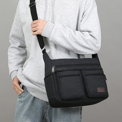 Neutral business casual crossbody bag - adjustable shoulder straps, multiple zippered compartments, durable black polyester lini