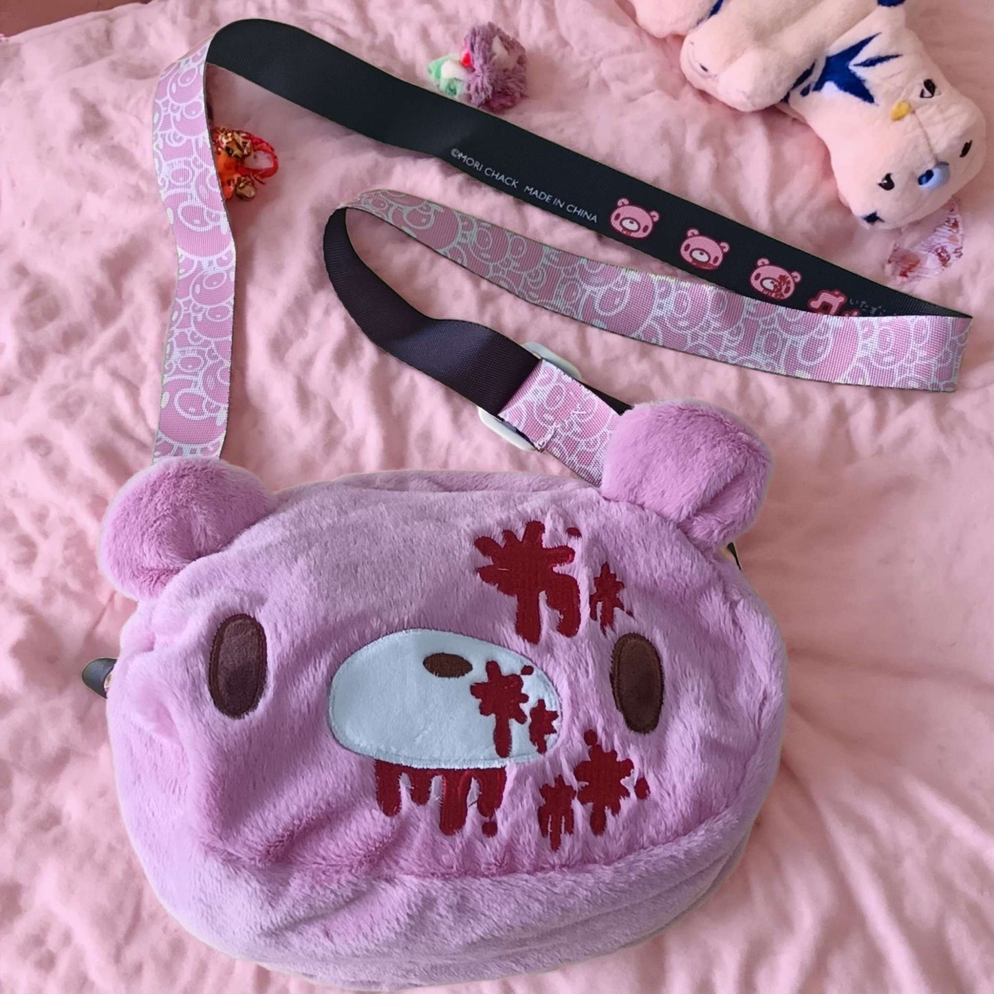 Gloomy Bear plush crossbody bag: Pink, cute - edgy with “blood - splatter” details. A fun, unique pick for fans.