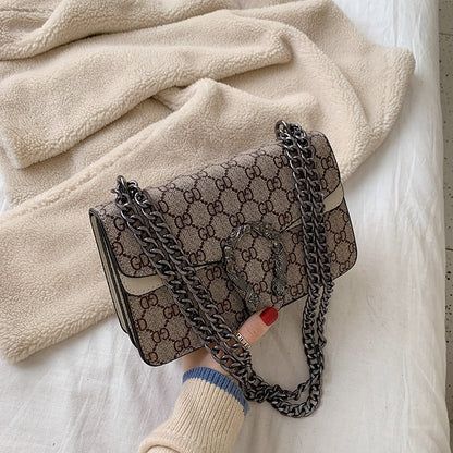 Retro PU women's crossbody bag with magnetic snap button, lightweight shoulder bag and multi compartment daily essentials