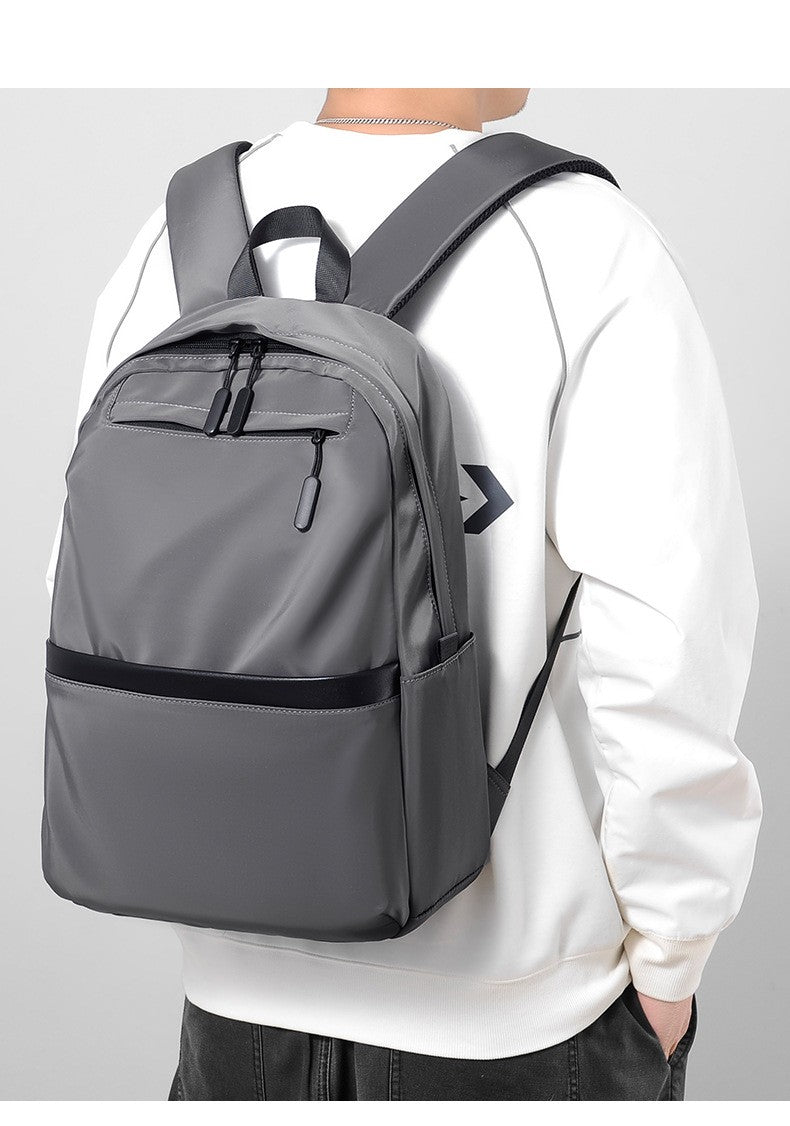 Mochila de negócios masculina de novo estilo, nylon, cor sólida, grande capacidade, mochila escolar para estudantes, mochila de viagem em promoção