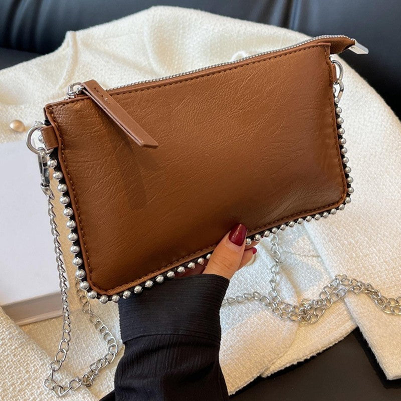 Women's retro classic bead chain design elegant and exquisite crossbody bag solid color commuting envelope bag.