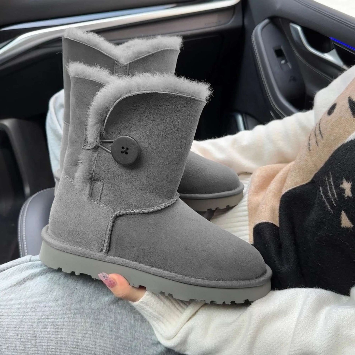 A pair of pure sheepskin and wool winter snow boots for women, warm and comfortable. Simple and fashionable women's shoes