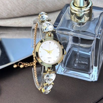 Ladies' quartz watch with three heart-shaped diamond-encrusted bracelet round alloy case and mixed scale simple light luxury