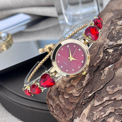 Ladies' quartz watch with three heart-shaped diamond-encrusted bracelet round alloy case and mixed scale simple light luxury