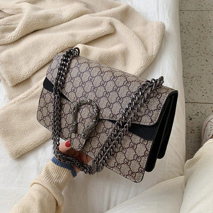 Retro PU women's crossbody bag with magnetic snap button, lightweight shoulder bag and multi compartment daily essentials