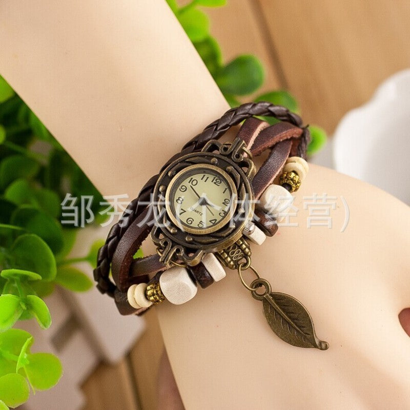 Foreign trade hot selling retro cowhide wrapped bracelet watch, ladies' delicate watch, leaf and leaf pendant decoration, studen