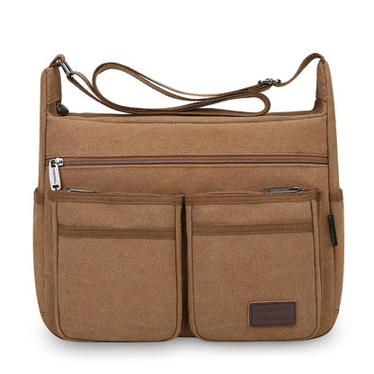 Neutral business casual crossbody bag - adjustable shoulder straps, multiple zippered compartments, durable black polyester lini