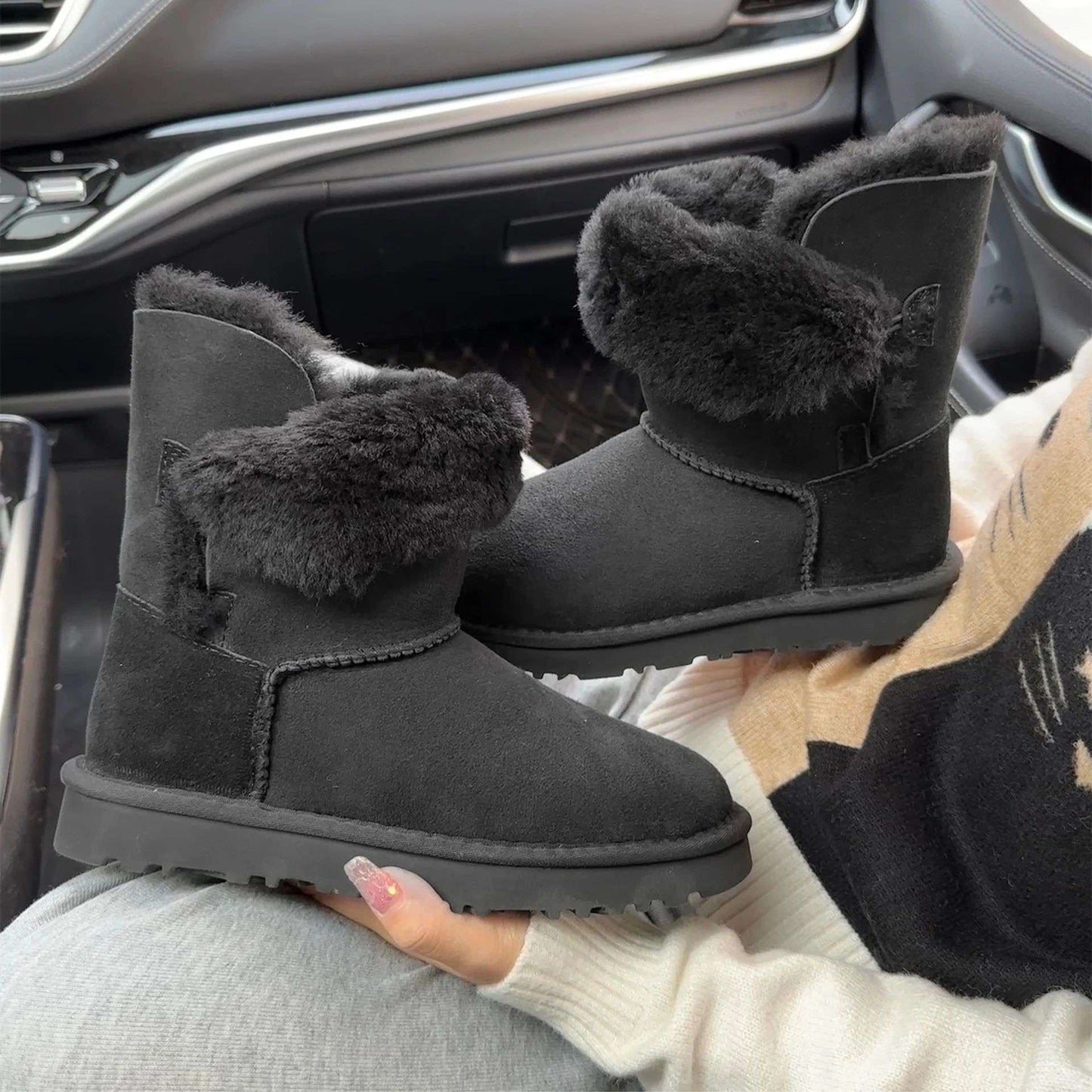 A pair of pure sheepskin and wool winter snow boots for women, warm and comfortable. Simple and fashionable women's shoes