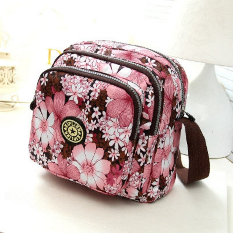 Women's nylon shoulder bag with floral print and multiple compartments, casual crossbody bag