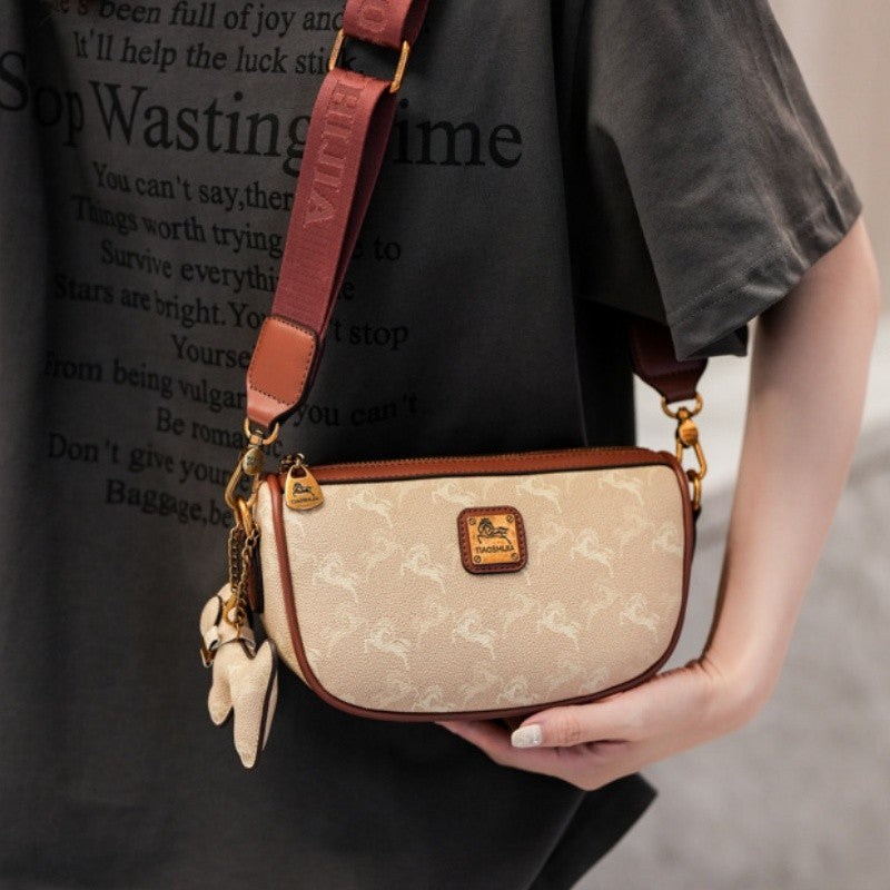 Classic style handbag with strap, featuring a shoulder-sling design, suitable for women, with a bag shape resembling