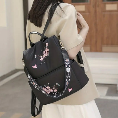 Neutral style backpack for men and women, suitable for daily travel and outings. Features a rear zipper with printed design.