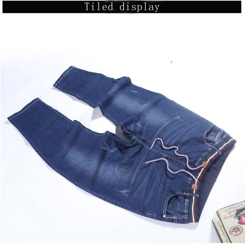 Autumn plus size casual jeans fashion men's pocket elastic waist straight plus size high elastic jeans.