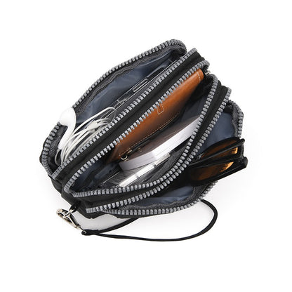 The 3-layer zipper clutch is lightweight, compact and versatile for ladies. It can be used with mobile phones or loose change