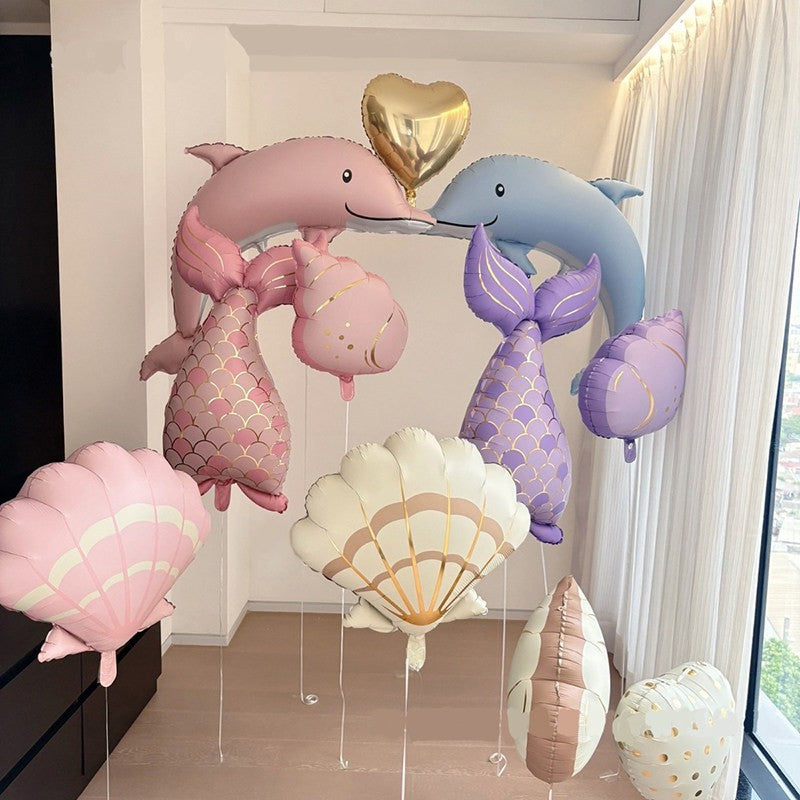 insOcean-themed girl princess mermaid tail, shells, dolphin, conch, balloons birthday party event decoration