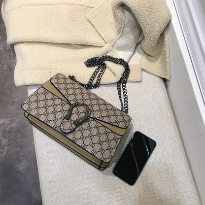 Retro PU women's crossbody bag with magnetic snap button, lightweight shoulder bag and multi compartment daily essentials