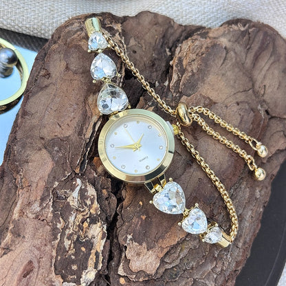 Ladies' quartz watch with three heart-shaped diamond-encrusted bracelet round alloy case and mixed scale simple light luxury