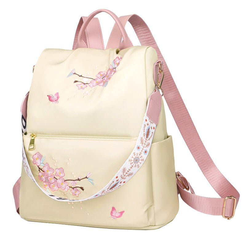 Neutral style backpack for men and women, suitable for daily travel and outings. Features a rear zipper with printed design.