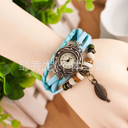 Foreign trade hot selling retro cowhide wrapped bracelet watch, ladies' delicate watch, leaf and leaf pendant decoration, studen