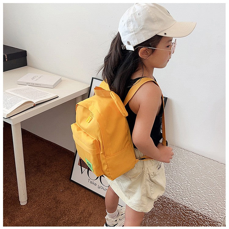 Mochila infantil fofa estilo novo para meninos e meninas estudantes do jardim de infância mochila escolar casual de cor sólida