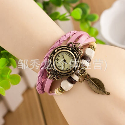 Foreign trade hot selling retro cowhide wrapped bracelet watch, ladies' delicate watch, leaf and leaf pendant decoration, studen