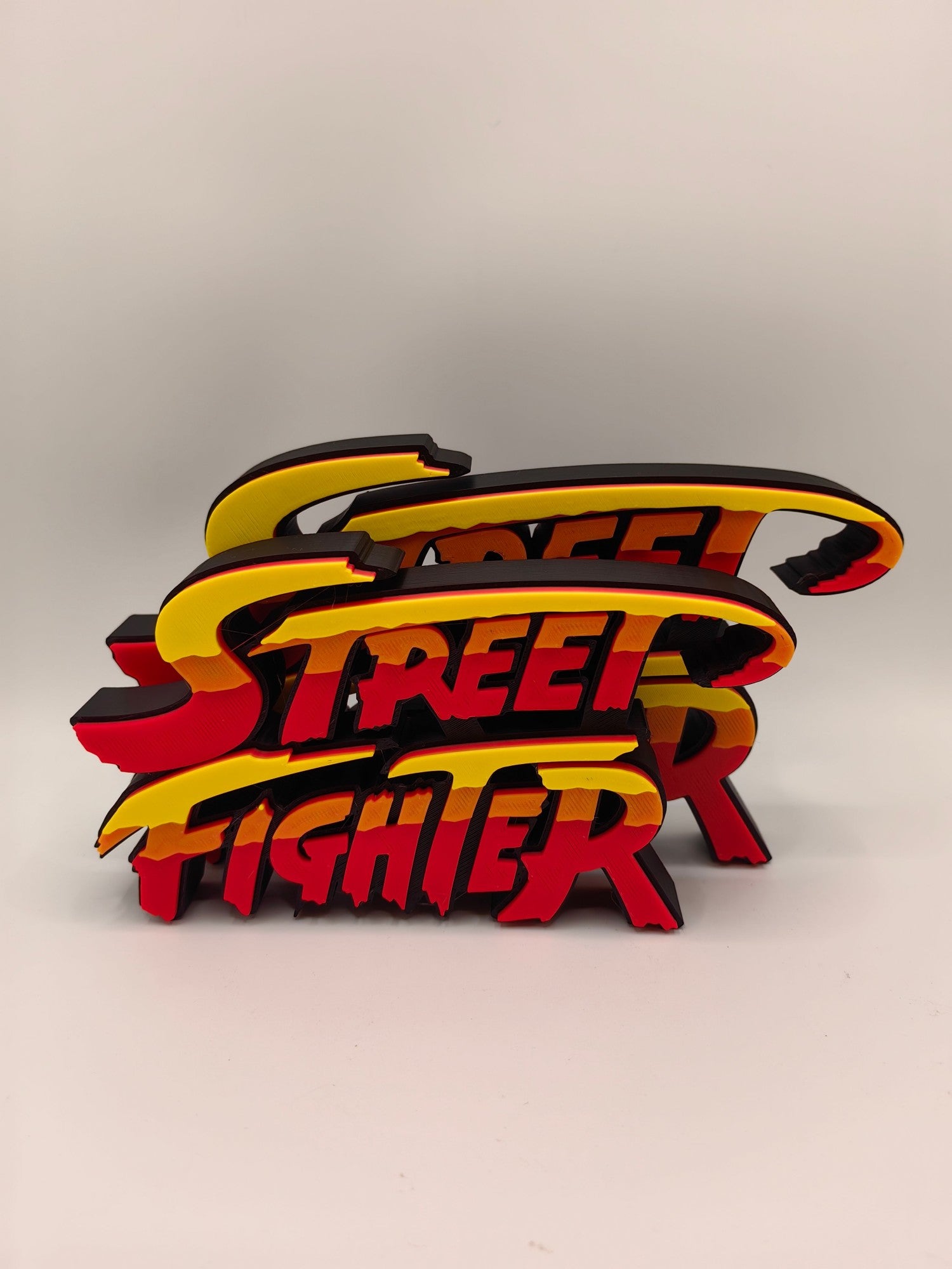 Street Fighter, Street Fighter (abbreviation), arcade game, Street Fighter Logo, signboard, action figure, ornament.