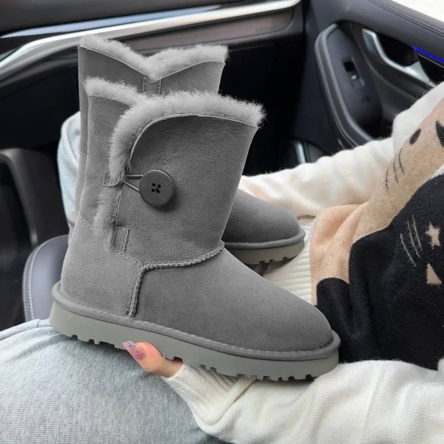 A pair of pure sheepskin and wool winter snow boots for women, warm and comfortable. Simple and fashionable women's shoes