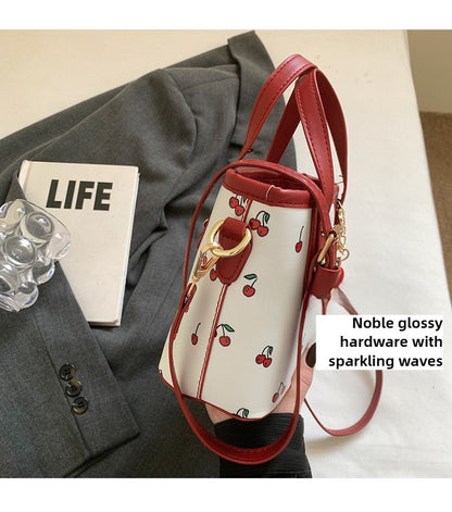 Women PU Cherry Shoulder Bag Large Capacity Trendy Commuting Bag with Cherry Pendant Stylish Crossbody Bag Aesthetic Handbag