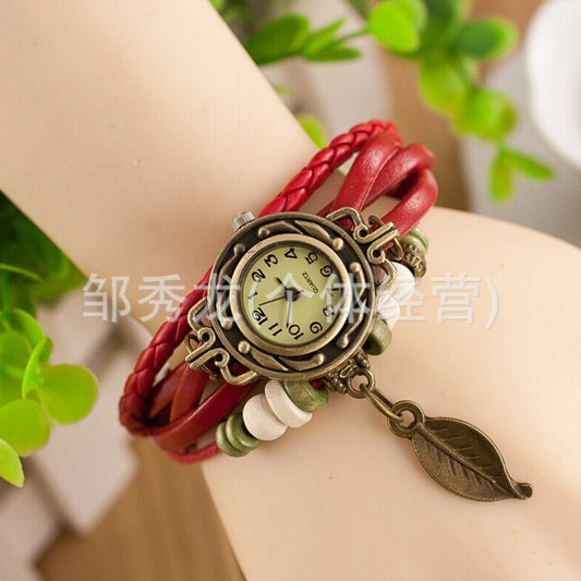Foreign trade hot selling retro cowhide wrapped bracelet watch, ladies' delicate watch, leaf and leaf pendant decoration, studen