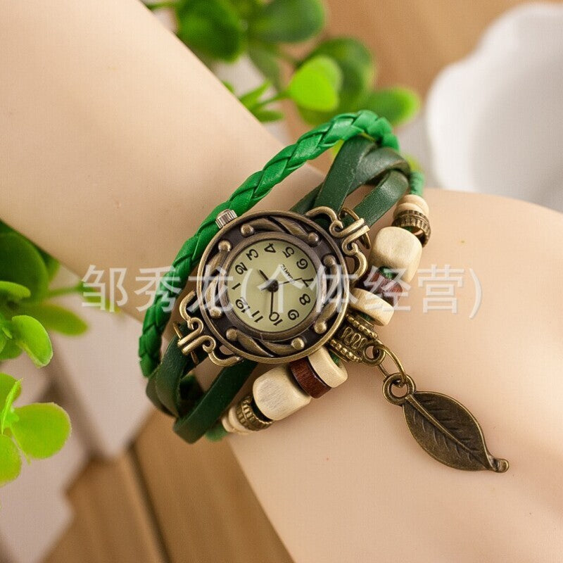 Foreign trade hot selling retro cowhide wrapped bracelet watch, ladies' delicate watch, leaf and leaf pendant decoration, studen