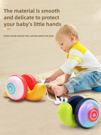 Children's Pull-Along Snail Toy, Baby Learning to Walk and Crawl Toy, Pull String Leash with Lights and Music